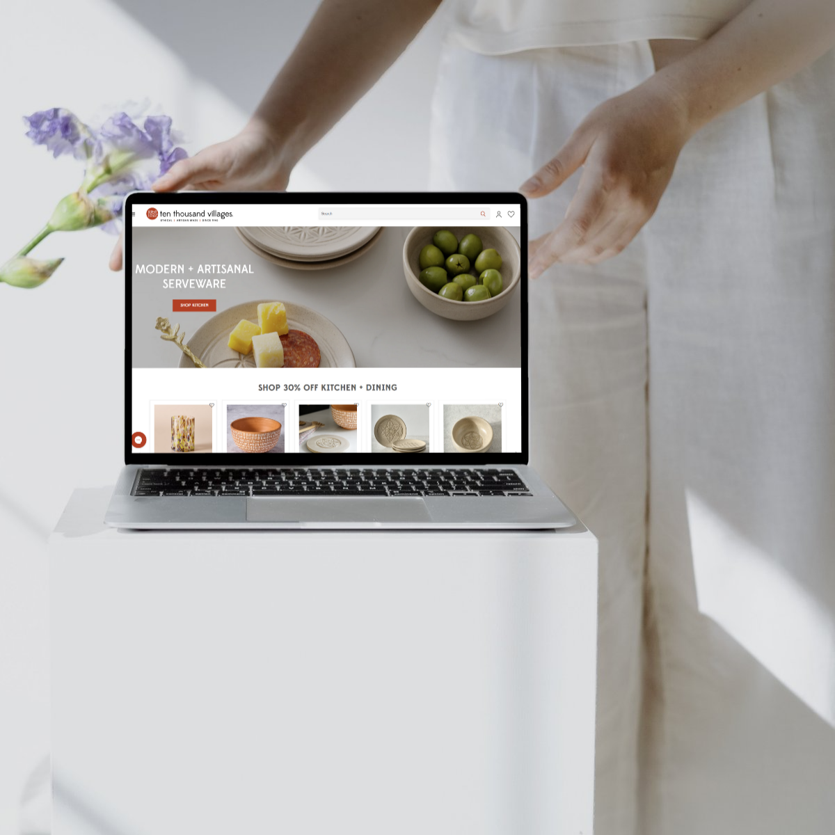 Shopify ecommerce website for Ten Thousand Villages displayed on a sleek laptop, featuring modern and artisanal serveware. Aesthetic and user-friendly website design for ethical and sustainable brands.