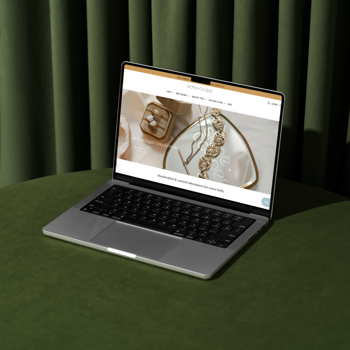 Luxury Shopify website for an one-of-a-kind vintage fine jewelry brand, showcased on a sleek laptop with a rich velvet backdrop. Bespoke ecommerce design for vintage-inspired jewelry collections with an elevated, artistic edge.