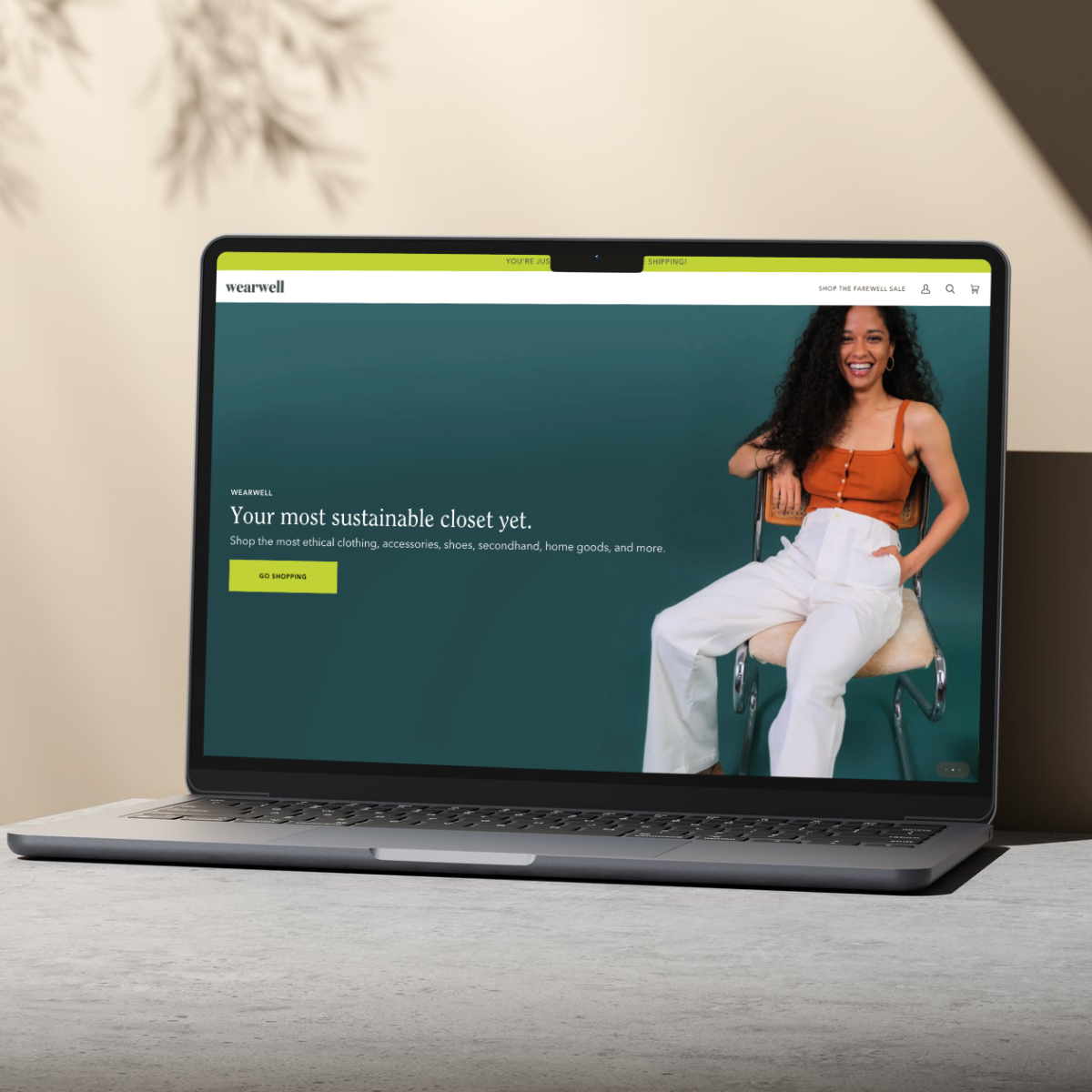 Sustainable fashion ecommerce website design for Wearwell displayed on a sleek laptop. The homepage highlights ethical clothing, accessories, and home goods with a minimalist, user-friendly interface. An ideal example of conversion-optimized design for small and midsize businesses in ethical retail.