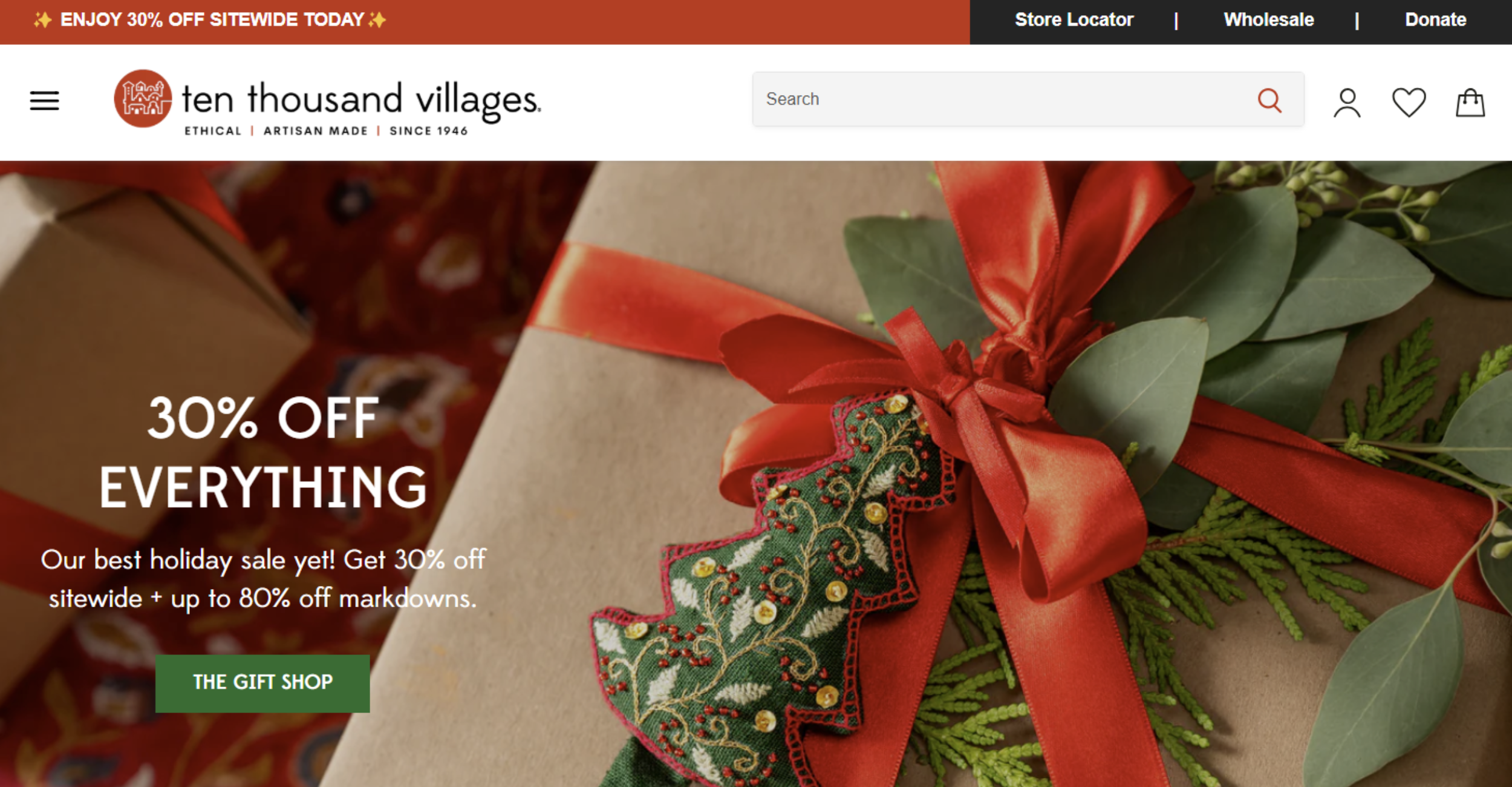Holiday-themed ecommerce website banner featuring a beautifully wrapped gift with a red ribbon and festive greenery, promoting a 30% off sitewide sale. Showcasing conversion-focused web design for ethical and artisan-made products.